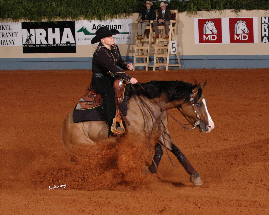 Esbarrada (sliding stop) em prova de rédeas da NRHA
